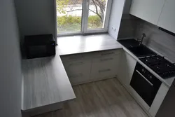 Photo of a kitchen in Khrushchev with a window sill table