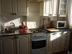 Kitchen with a regular gas stove photo