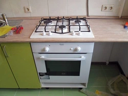 Kitchen with a regular gas stove photo