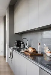 White kitchen gray apron in the interior photo