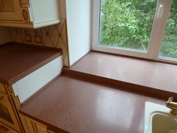 If the countertop is higher than the window sill in the kitchen photo