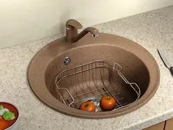 Kitchen with a round sink made of artificial stone photo