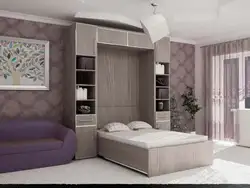 Wardrobe with sofa in bedroom photo