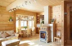 Kitchen and living room at the dacha in a wooden house photo