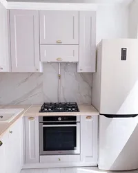 Kitchen interior with gas heater in Khrushchev and refrigerator