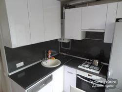 Kitchen interior with gas heater in Khrushchev and refrigerator