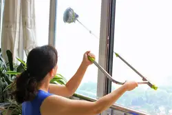 Washing windows in an apartment photo