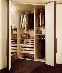 Dressing Room With Compartment Door To The Hallway Photo