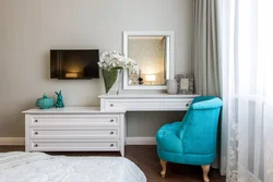 Dressing table with chest of drawers in the bedroom in the interior
