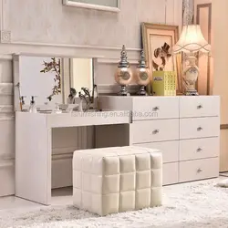 Dressing table with chest of drawers in the bedroom in the interior