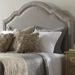 Photo of a bedroom with a fabric bed