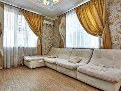 Design of curtains in the living room with two windows in a modern style photo