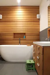 Finishing a bathroom in a wooden house with plastic panels photo