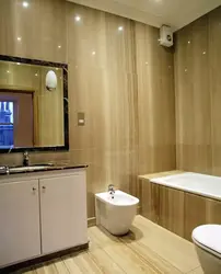 Finishing A Bathroom In A Wooden House With Plastic Panels Photo