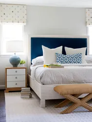 Soft blue bed in the bedroom interior