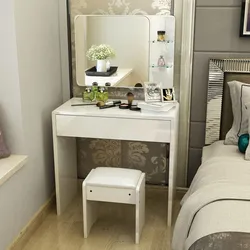 Bedroom interior with chest of drawers and dressing table