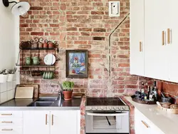Photo of kitchen interior with red brick