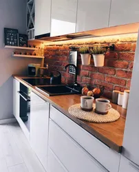 Photo Of Kitchen Interior With Red Brick