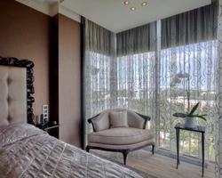 Corner Bedroom With Balcony And Window Design