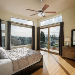 Corner bedroom with balcony and window design