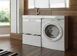 Photo of a bathroom cabinet with a washing machine