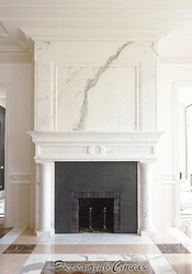 Fireplace in the interior of the living room in marble