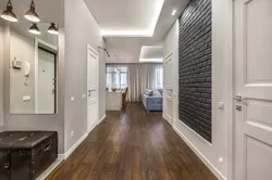 Hallway Design In An Apartment With White Doors Photo