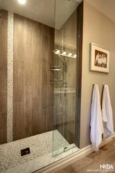 Bathroom design with wood tile shower