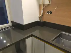 How to attach a plinth to a countertop and apron in the kitchen photo