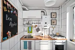 Kitchen design with a gas water heater by the window photo