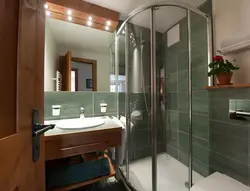 Shower cabin and bathtub in one bathroom photo design