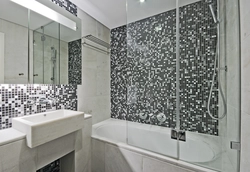 White bathtub with mosaic photo