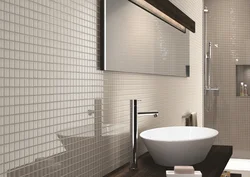 White bathtub with mosaic photo