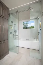 Shower next to the bath photo