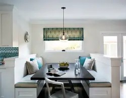 Kitchen design with sofa and dining table