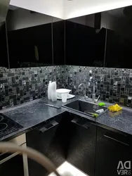 Gray kitchen with black countertop photo