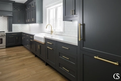 Gray kitchen with dark countertop and apron photo