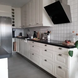 Gray kitchen with dark countertop and apron photo
