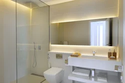 Bath design with large mirror photo