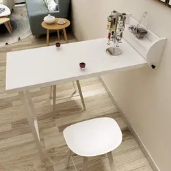 Table Attached To The Wall In The Kitchen Photo