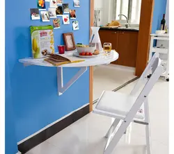 Table Attached To The Wall In The Kitchen Photo