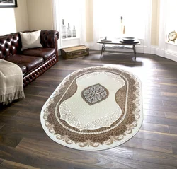 Oval carpet in the living room on the floor photo