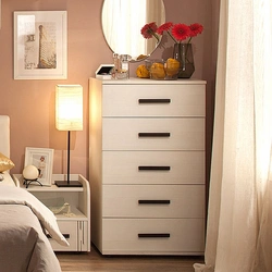 Wardrobe chest of drawers for linen and clothes in the bedroom photo