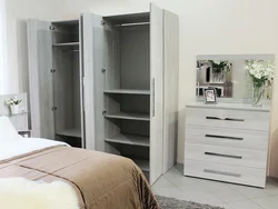 Wardrobe chest of drawers for linen and clothes in the bedroom photo