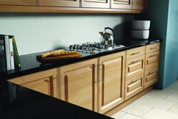 Photo of kitchen wood-effect countertop and facade