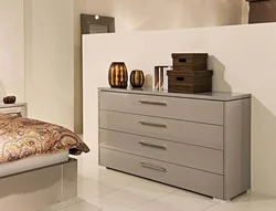 Chests of drawers in the design of a small bedroom with photos
