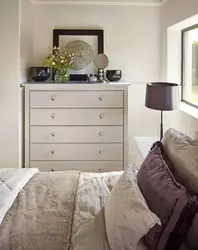 Chests of drawers in the design of a small bedroom with photos