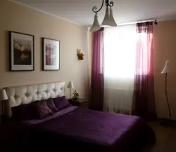 Purple curtains in the bedroom interior