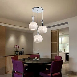 Chandeliers in the interior of a white kitchen
