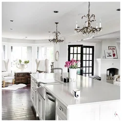 Chandeliers In The Interior Of A White Kitchen